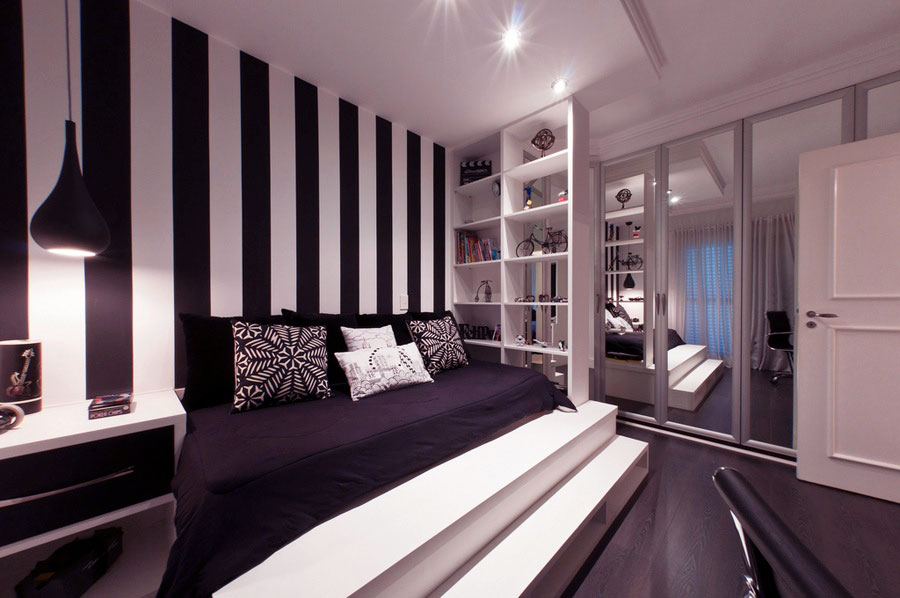 Современный дизайн спальной комнаты с полосатым акцентом на стене