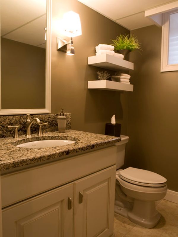 Дизайн ванной комнаты с раковиной вмонтированной в столешницу тумбы из натурального камня 