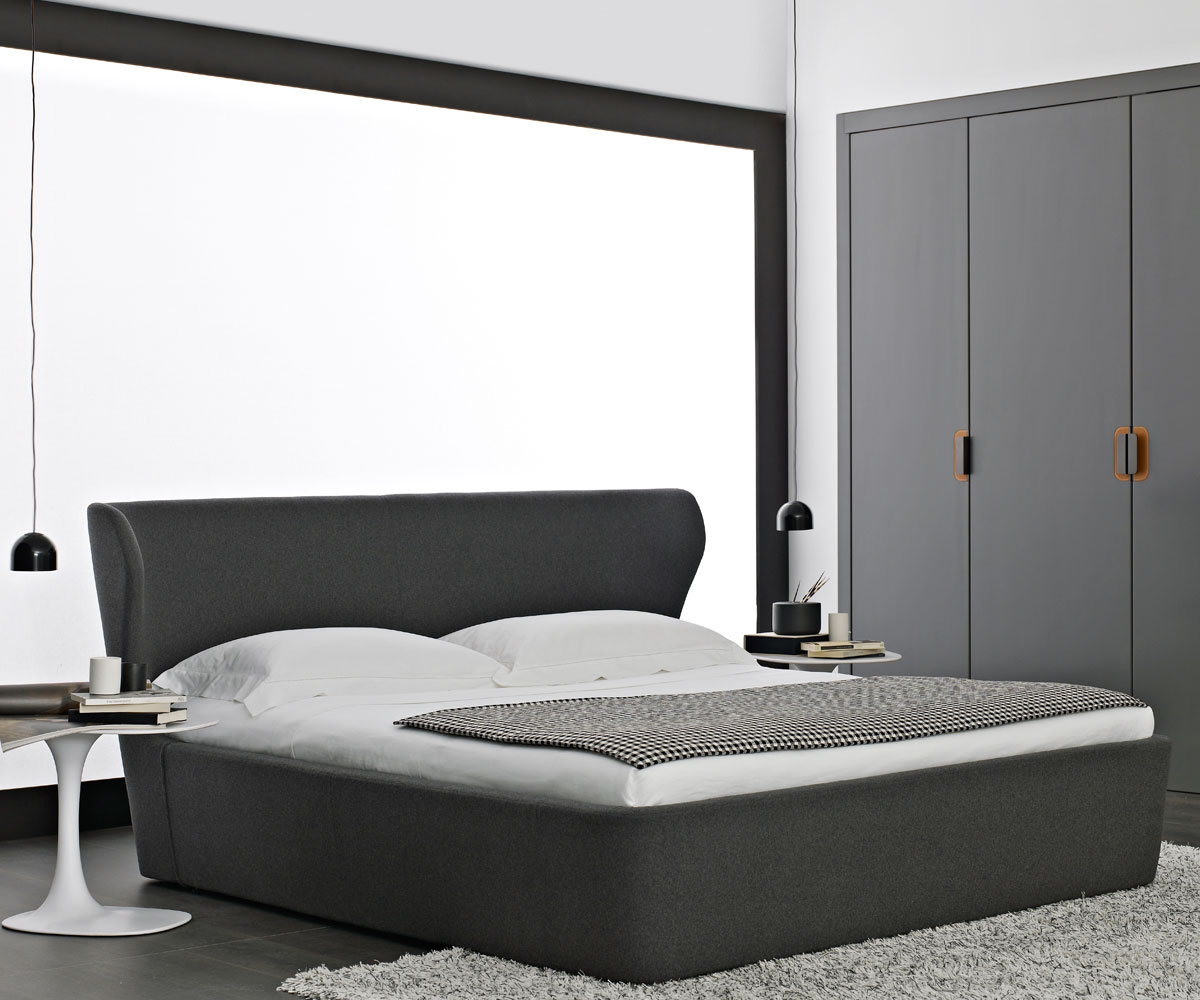 Удобная мебель для спальни - двуспальная кровать серого цвета с необычным изголовьем