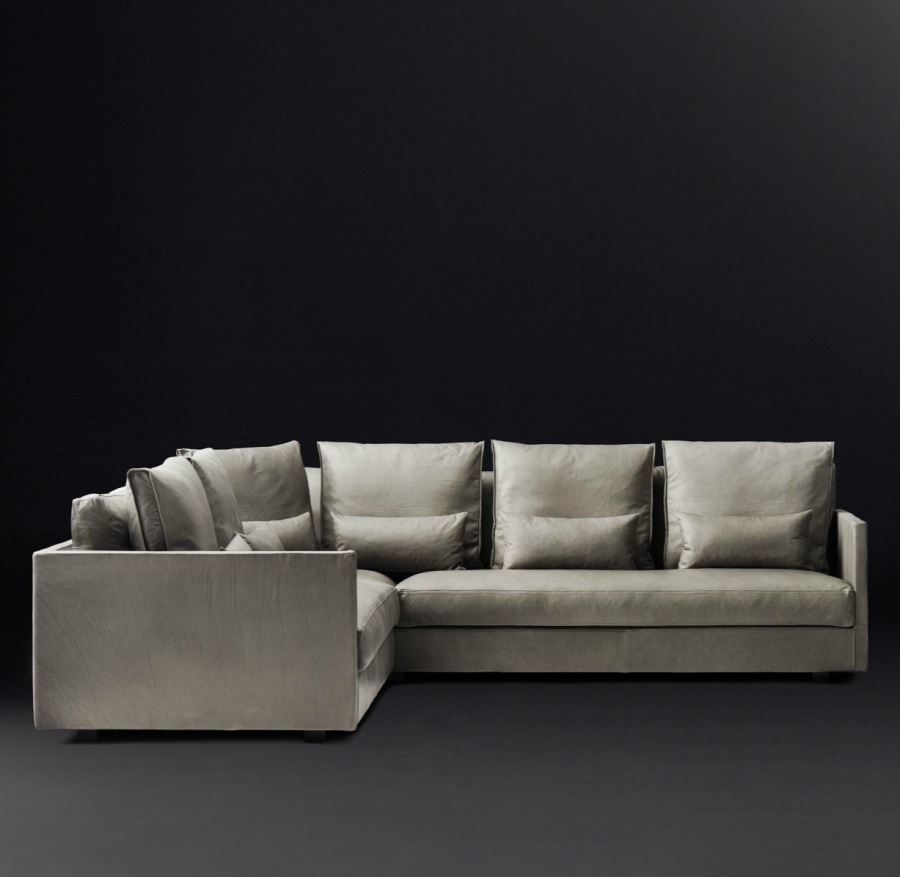 Угловая мебель в интерьере вашей комнаты: диван с блестящей обивкой
